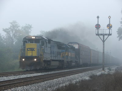 A westbound Q217 heads by the foggy CPL's @ Hansrote, WV