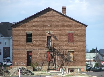 The old Fredericksburg freight depot still stands in the new apartment complex without a view of the tracks.