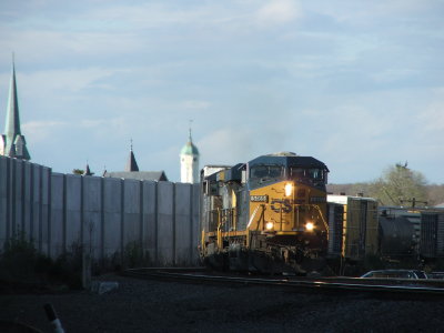 Q439 with CSX leader 5469 heads south with many steeples in the background.  The large on is a good 1/2 mile away.  