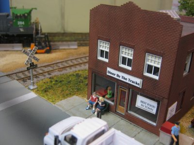 A great spot to railfan is the bench in front of the diner.  Looks as if they are more interested in the food!