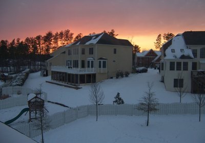 Snowy neighborhood at sunrise
