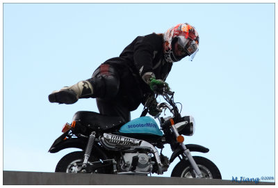 Female stunt (riding the scooter)