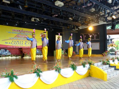 These Malaysian men performed traditional Malaysian dance in traditional Malaysian costumes.