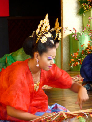 Close-up of one of the female fan dancers.