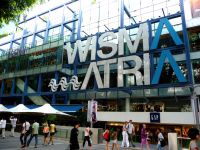 Shoppers and tourists strolling down Orchard Road.