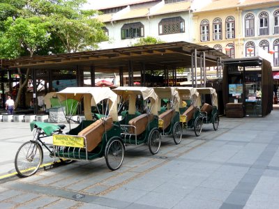 Cyclos lined up for hire in Singapore's Chinatown.