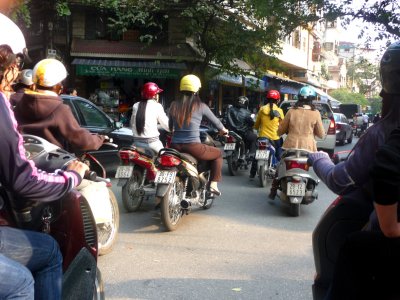 The cyclo driver rode me through motorbike traffic in Hanoi. The ride was exhilarating, but the exhaust fumes were terrible!