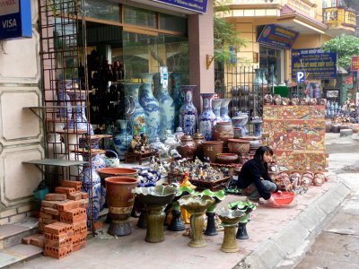 A pottery shop at the Bat Trang ceramic village with the items for sale out in front.
