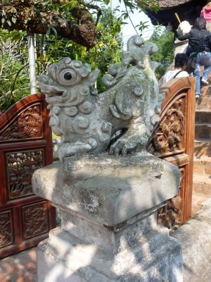 At the base of the stairs of the pagoda is this stone dragon carving.