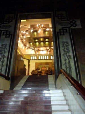Dramatic image of Ho Chi Minh's imposing statue at the top of the stairs in his museum.