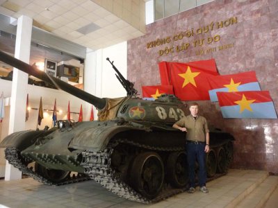 Me posing in front of the North Vietnamese tank that seized the Saigon Presidential Palace in 1975.
