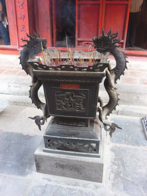 This dragon-carved incense burner is used for burning religious incense.