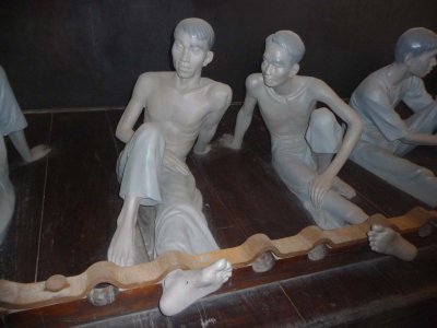 Conditions were horrible in the Hanoi Hilton. This is a depiction of soldiers shackled together in one big room.