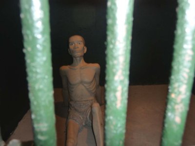 Depiction of a prisoner alone in his cell.