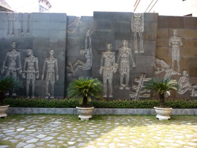 An outdoor mural depicting some of the Hanoi Hilton's prisoners.