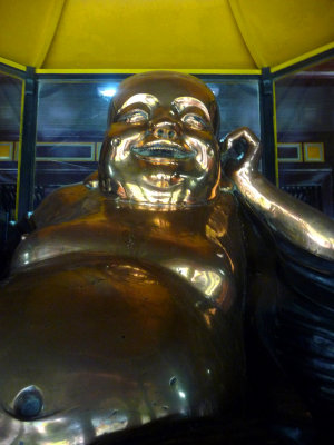 A happy Buddha (with a big belly) in the sanctuary at the Thien Mu Pagoda.