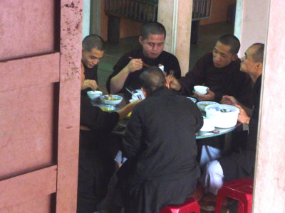 Monks having lunch in the sanctuary where they live.