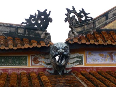 Note the wonderful designs on the top of this gate leading to Th Mieu.