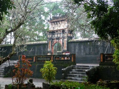 A side view of the Stele Pavilion through the trees.