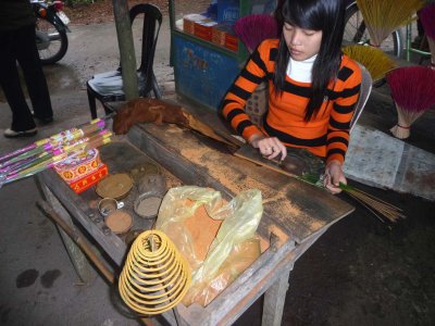 After leaving Tu Duc's tomb, I went to an incense shop where this Vietnamese girl taught me how to make incense sticks.