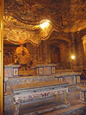 Golden statue in back of the interior of  Khai Thanh Palace where Khai Dinh was said to be buried under it.