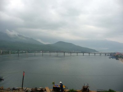 Coastline and a bridge on a cloudy day as we approached Danang.