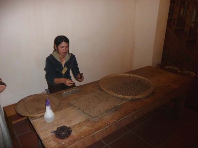 This woman was making sandalwood incense sticks.