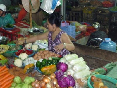 Close-up of another vendor selling eggs and vegetables.