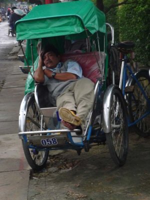 This cyclo driver was taking a late afternoon nap. That's how I felt after spending the day touring Hoi An!