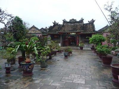 Potted plants decorate a patio garden inside the Fukien Assembly Hall compound at Hoi An.