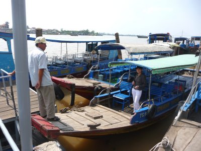 My attractive tour guide is standing in the boat, which took us to the Thoi Son Islet.
