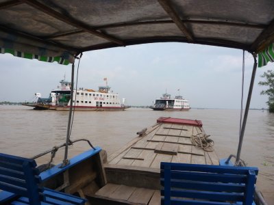 View from the boat that I was on of other boats ahead of us on the Mekong River.