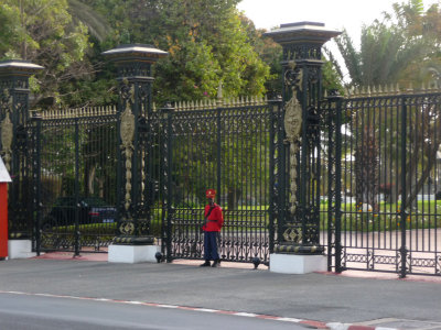 Guard in front of the Presidential Palace in Dakar, located on Roume Avenue.