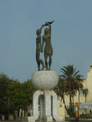 Close-up of the statue depicting an victorious-looking man and woman