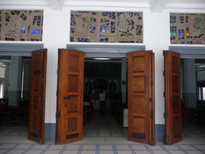 Wooden doors of the cathedral.  Many of its designs pay homage to African culture.