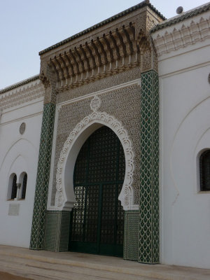 Close-up of an entrance to the mosque. It is richly decorated on the exterior and interior.