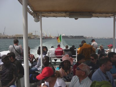 The ferry was crowded.  Beautiful women ride on the boat trying to lure customers to their shops on the island.