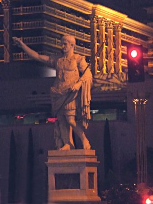 Close-up of Caesar with his arm up as if to greet guests arriving at Caesar's Palace.