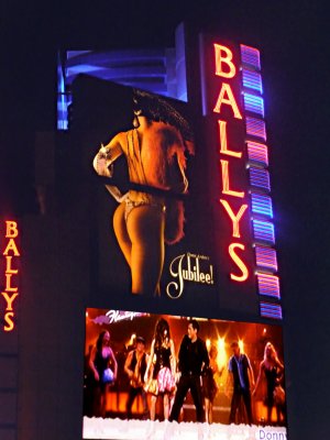 Ballys sign in neon with a sexy picture of a woman's behind.