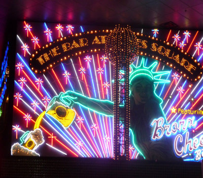 Brilliantly illuminated neon sign for the Bar at Times Square inside of New York, New York.