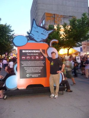 Me posing in front of the sign. This cat was prominent on many Jazz Festival billboards.