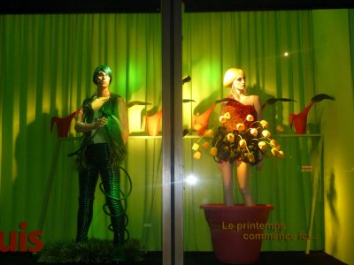 Great storefront window for a store called Place Dupuis.  The sign in French says, Spring starts here.