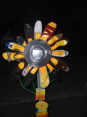 A sculpture of shoes with yellow souls that looked like a sunflower.