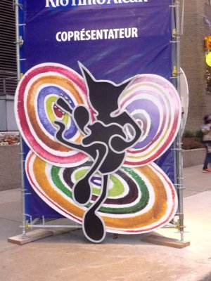 A view of this billboard of the psychedelic jazz festival cat.