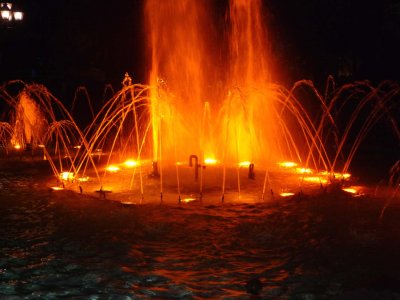 Illuminated fountain at night in Montral's Vauquelin Square.