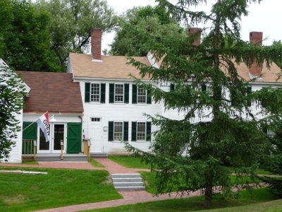 The Franklin Pierce Manse is a two-story frame building with a hipped roof.