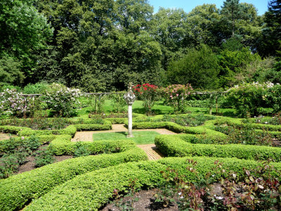 The formal rose garden surrounding a polyhedral sundial.