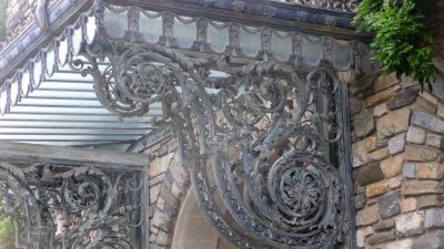 Elaborate metal designs on the porte cochre at the front of the mansion.