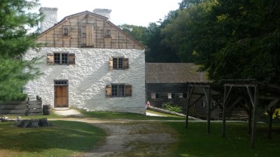 That is the gristmill behind the manor house.