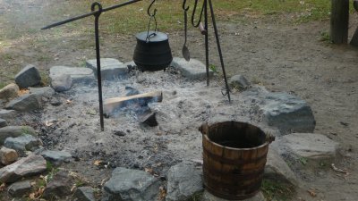 Close-up of the iron pot over the open fire.